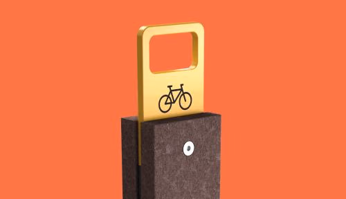 Estacionamento para bicicletas Frame da Floema Urban, equipamento para a mobilidade suave com estrutura em aço metalizado e pintado e plástico reciclado castanho.